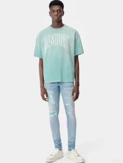 AMIRI Denim<VARSITY LOGO REPAIR JEAN PERFECT INDIGO